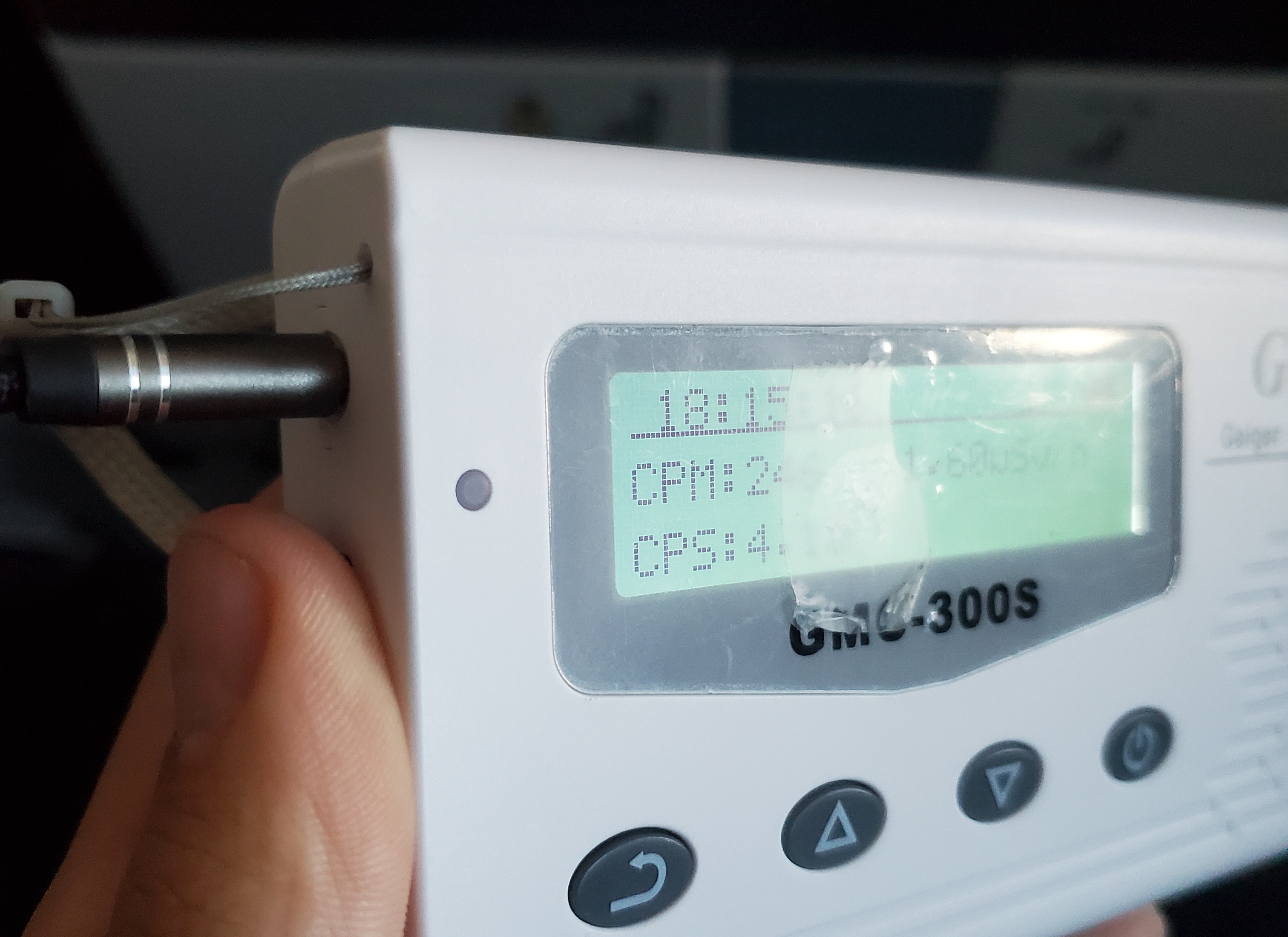 A headphone jack plugged into the Geiger counter